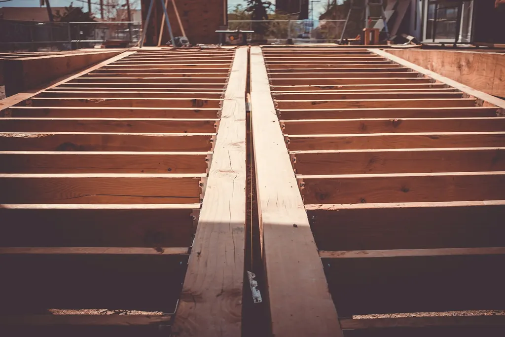 Deck framing with joists and a doubled beam, ready for decking